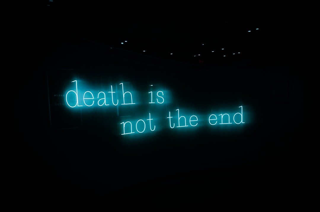 a neon sign that reads death is not the end