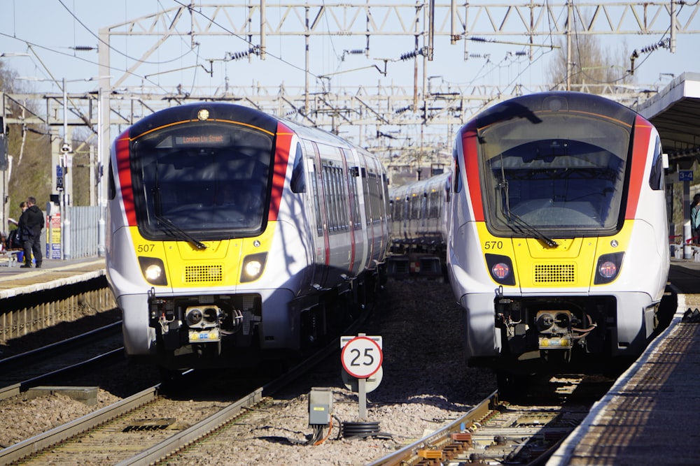 a couple of trains that are next to each other