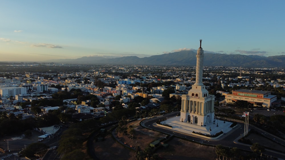 an aerial view of a city with mountains in the background