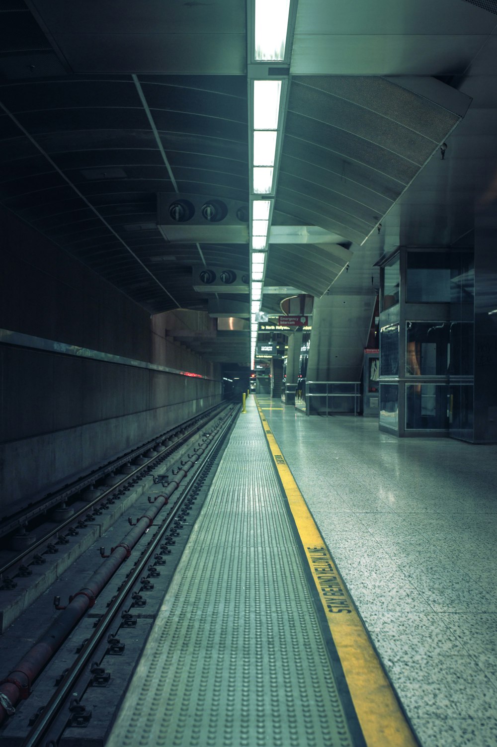 a train station with a train on the tracks