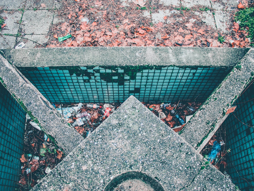 an aerial view of a concrete structure with a mesh fence