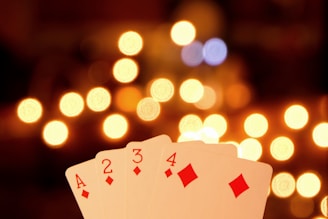 a pair of playing cards sitting on top of a table