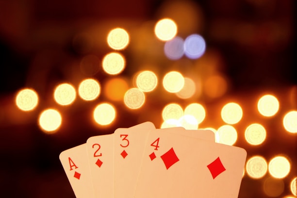 a pair of playing cards sitting on top of a table
