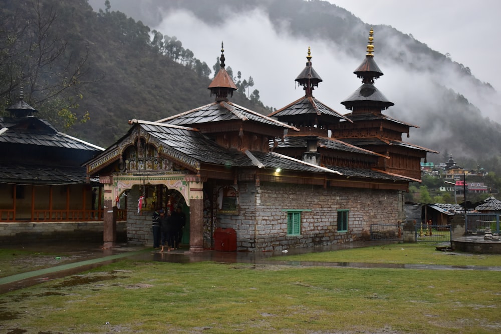 a small building with two towers on top of it