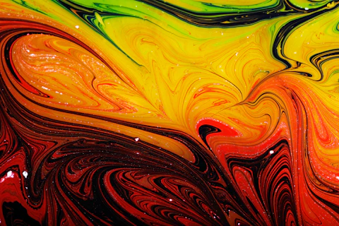 a close up view of a colorful liquid painting