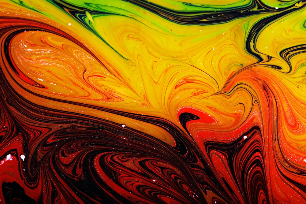 a close up view of a colorful liquid painting