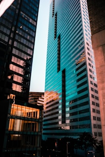 a couple of tall buildings sitting next to each other