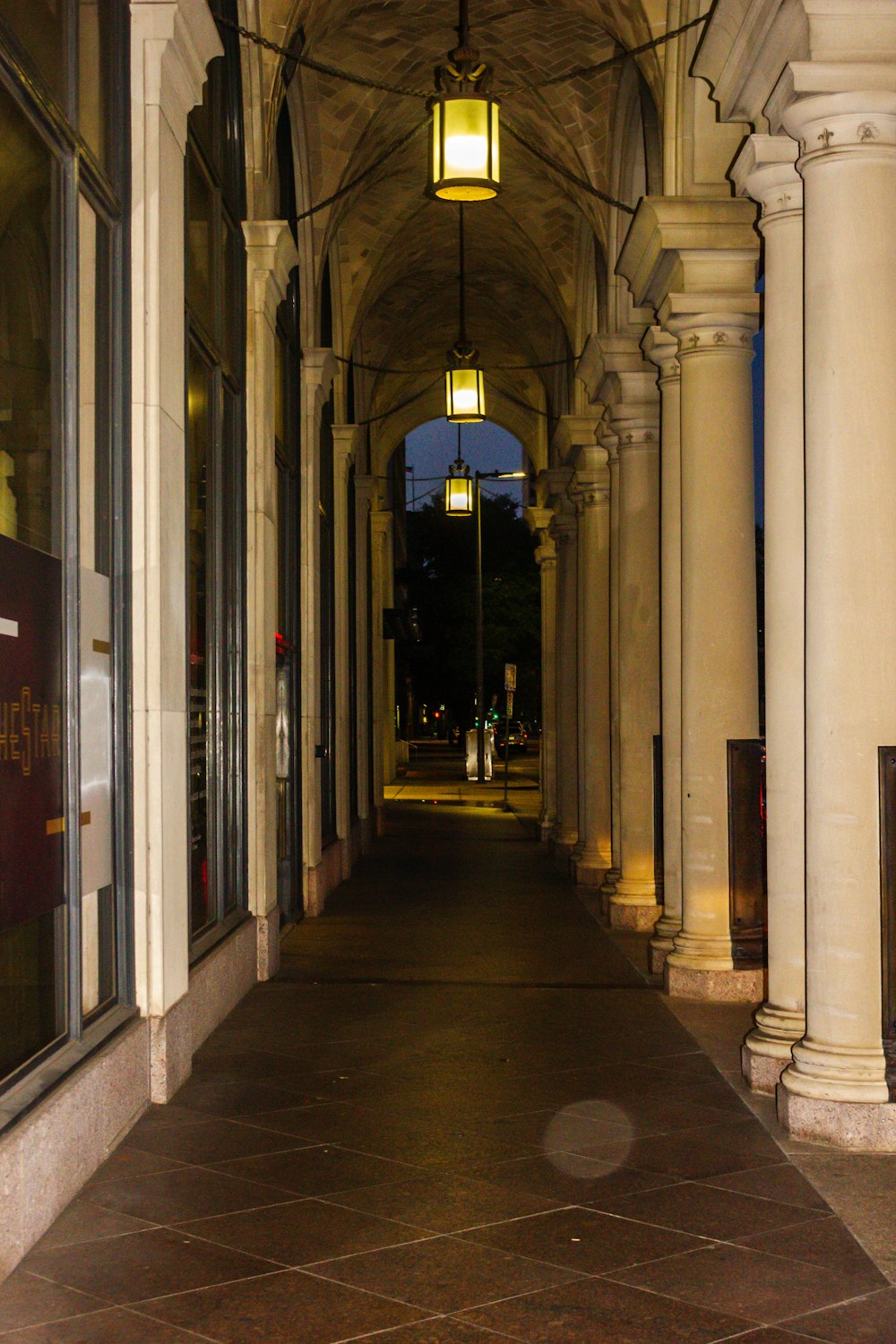 a long hallway with a clock on the wall