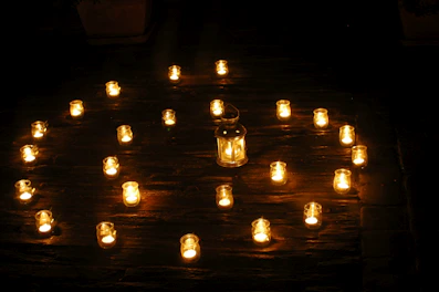 Artistic arrangement of mandala-inspired decorative objects glowing softly under warm light.