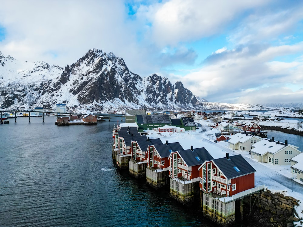 a group of houses sitting on top of a body of water