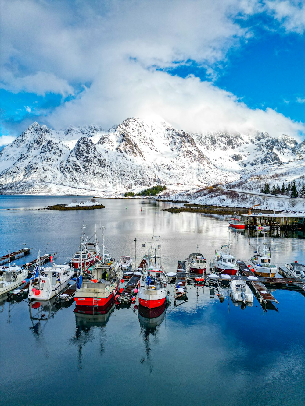 a group of boats that are sitting in the water