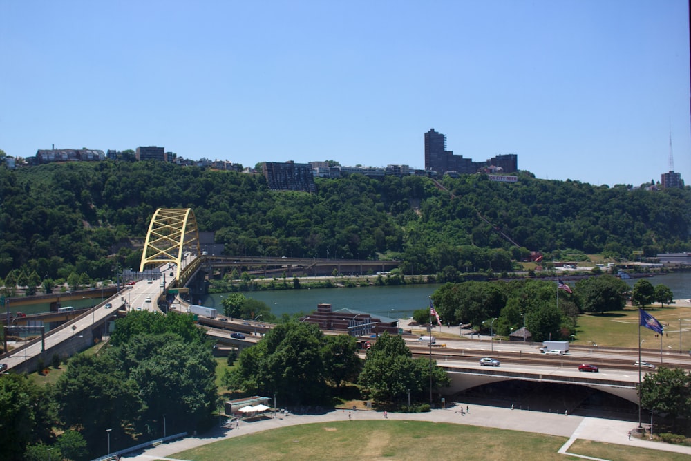 a view of a bridge over a river with a city in the background