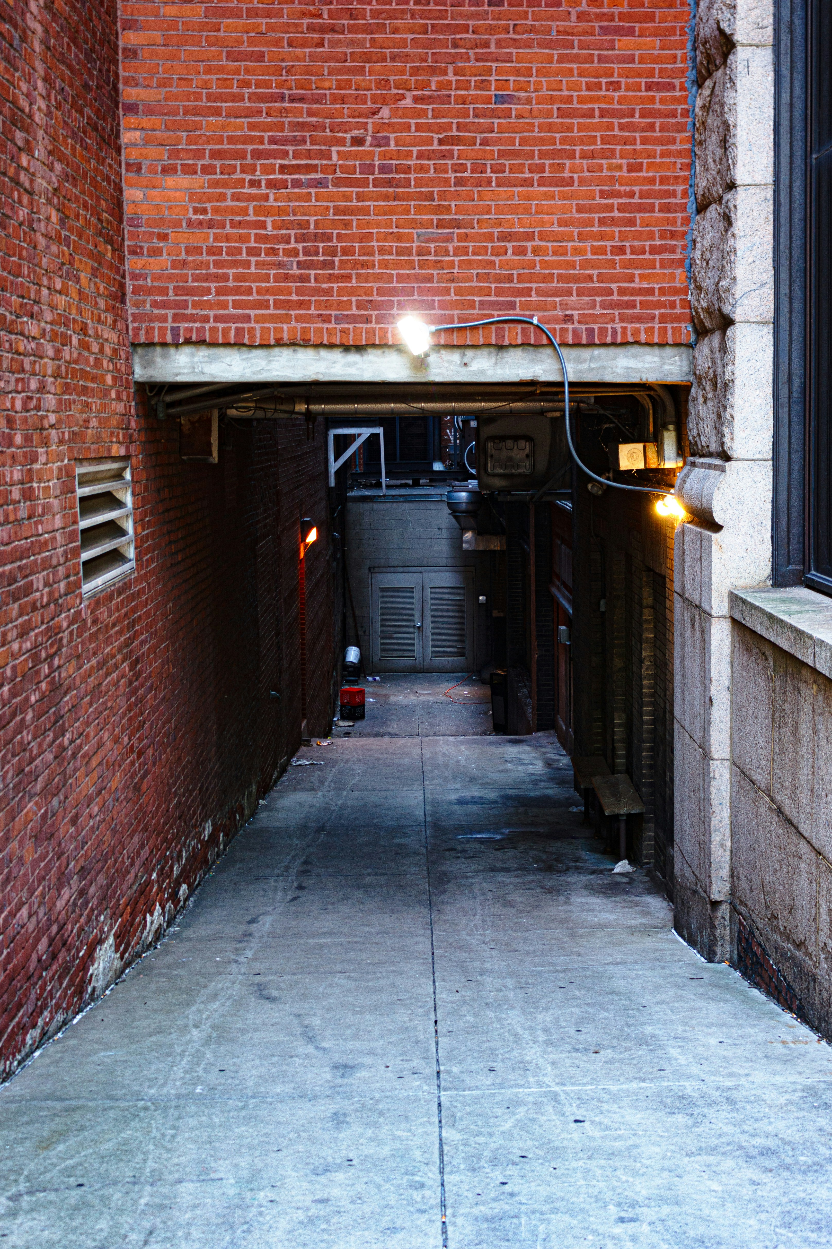 Gritty underground venue with raw aesthetic and exposed brick walls