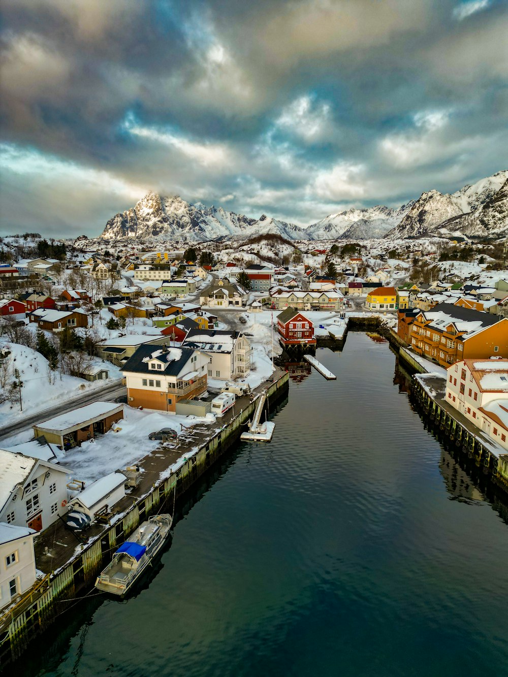 a river running through a snow covered town