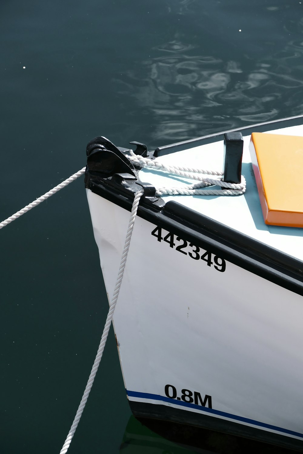 a small boat tied up to a dock