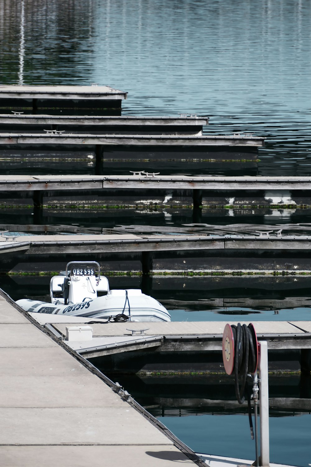a small boat is docked at a dock