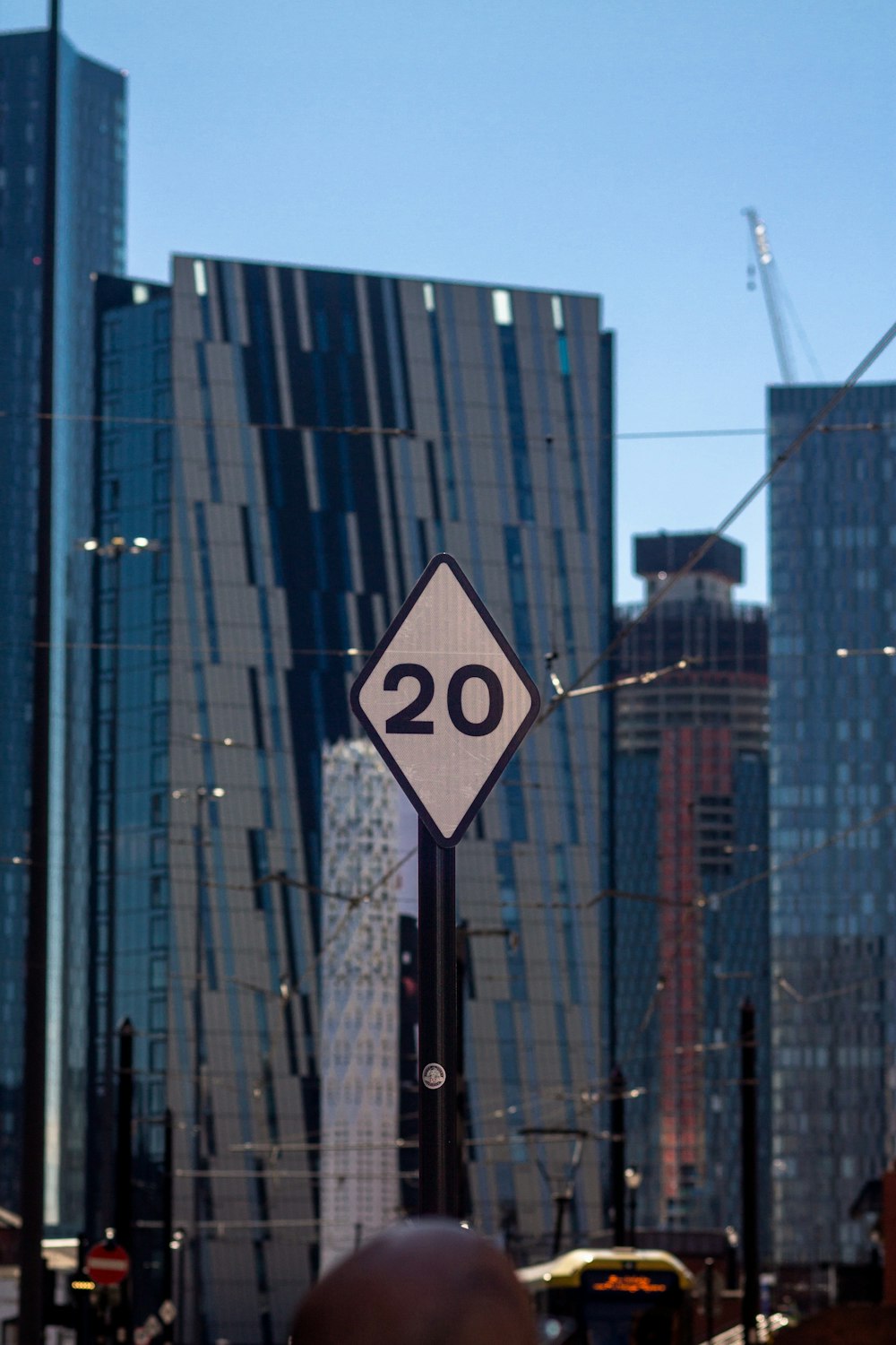 a street sign in front of some tall buildings