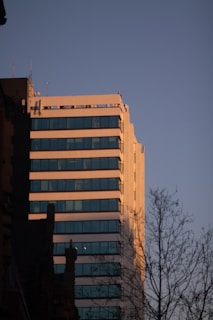 Office building exterior of Innovatia headquarters bathed in morning light.