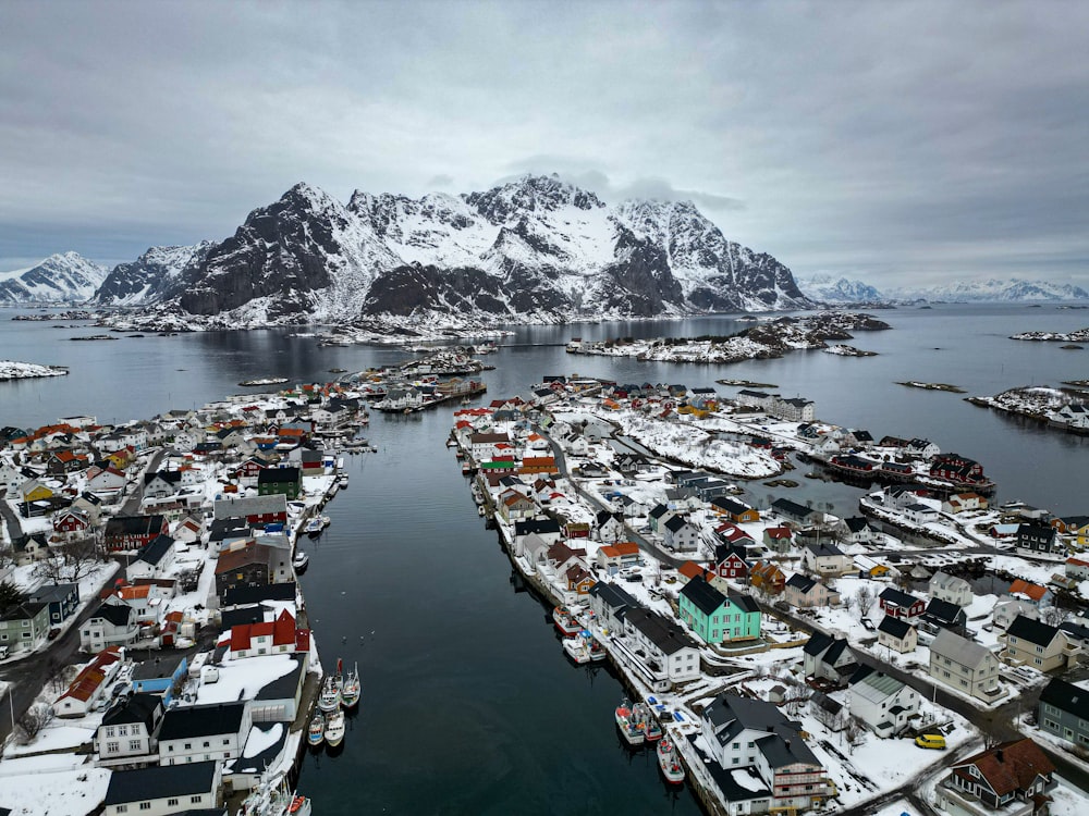 an aerial view of a city with a mountain in the background