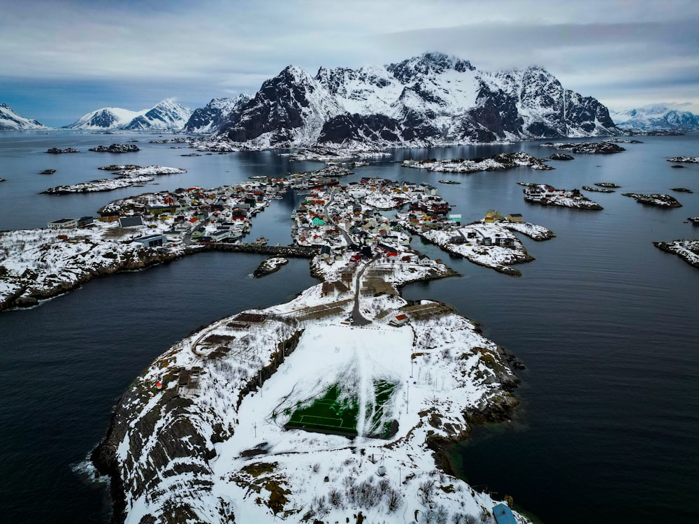 an aerial view of a small town in the middle of a body of water