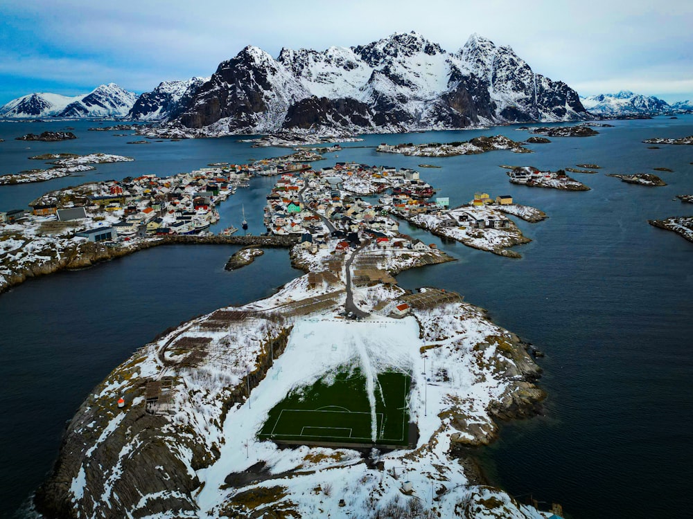 an aerial view of a soccer field in the snow