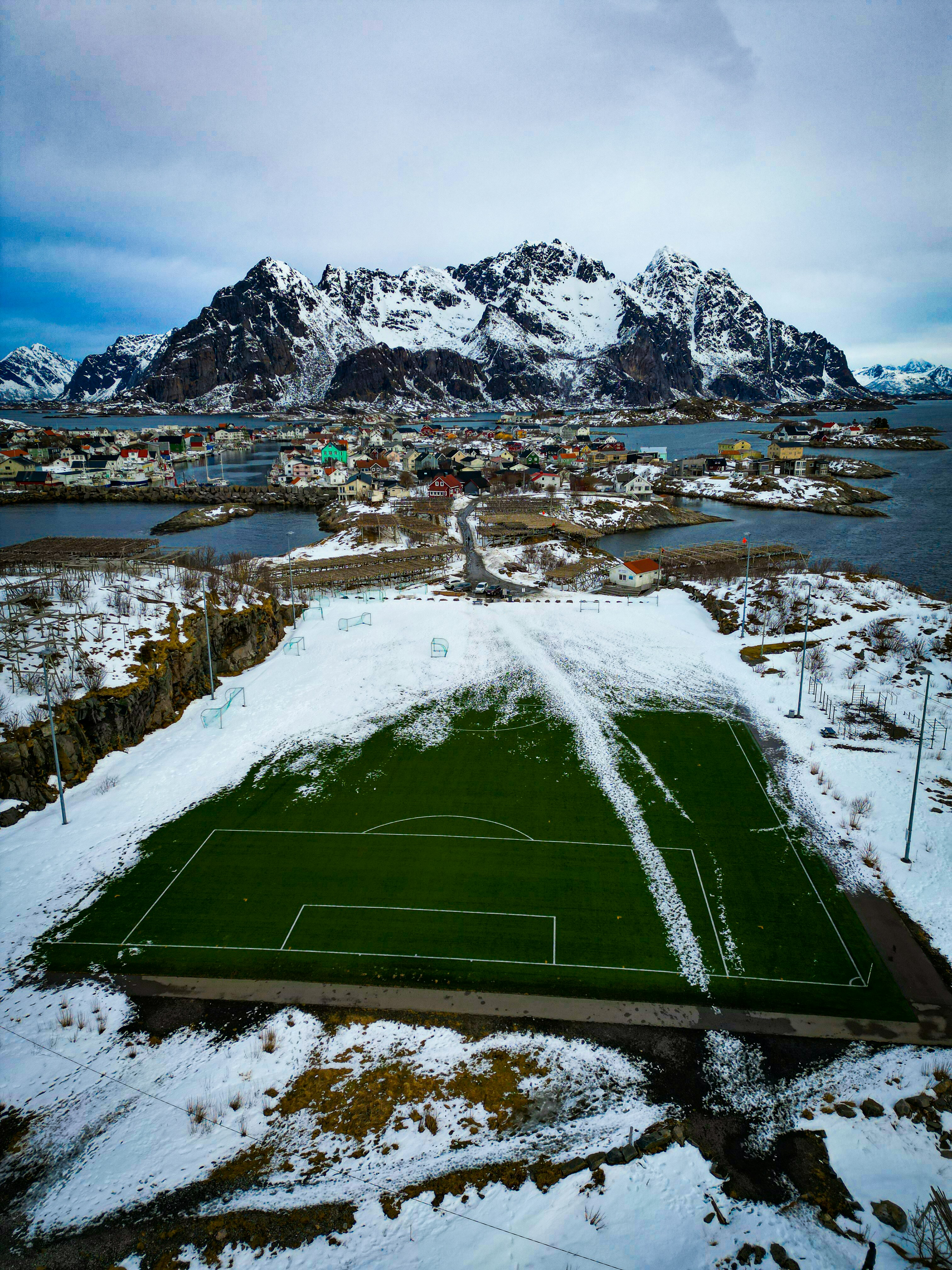an aerial view of a soccer field in the snow