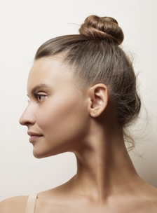 a woman with a bun in her hair