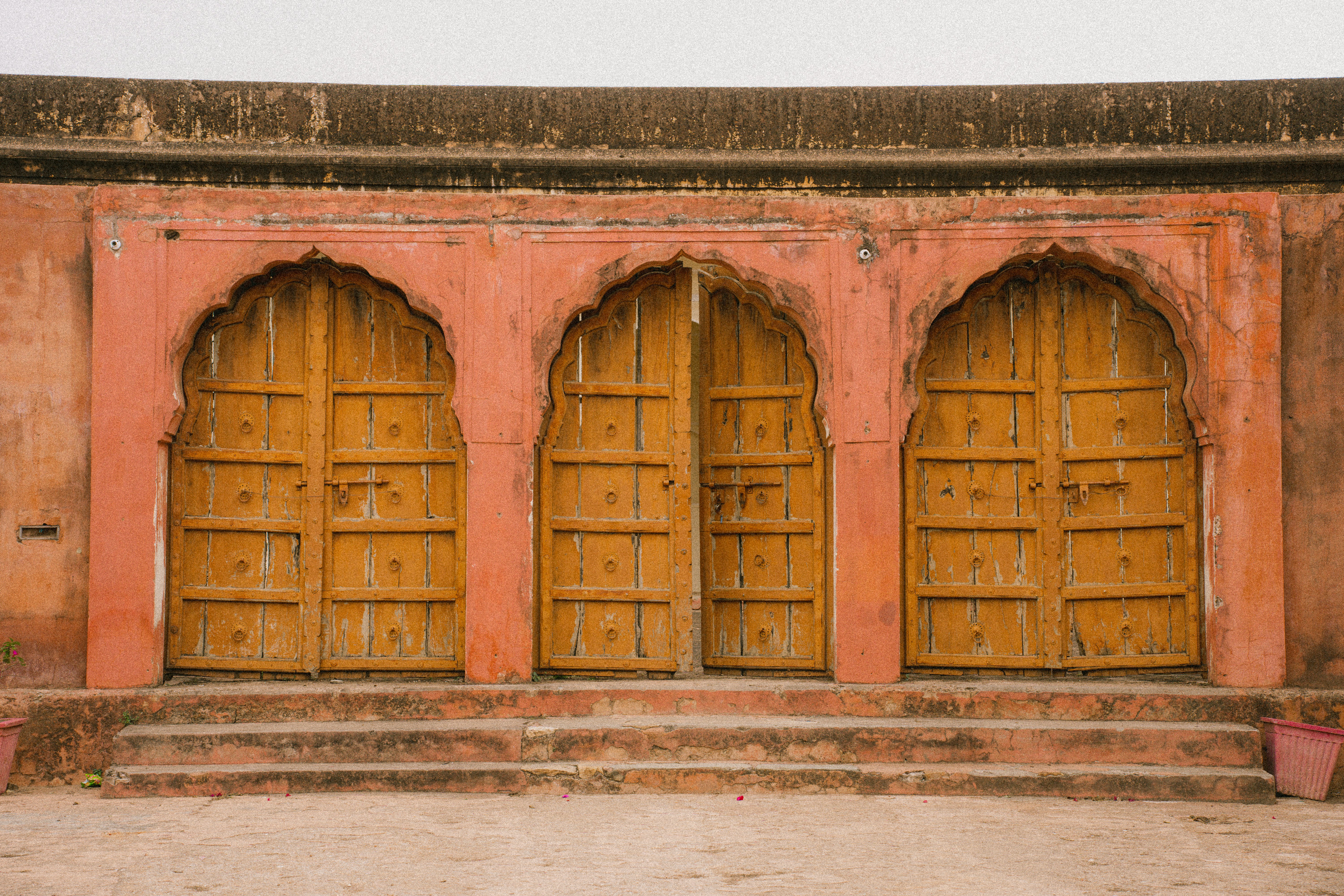 a couple of wooden doors sitting next to each other