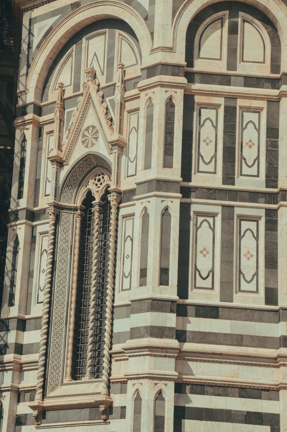 a tall building with a clock on the side of it