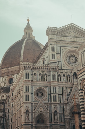 a large cathedral with a clock on it's side
