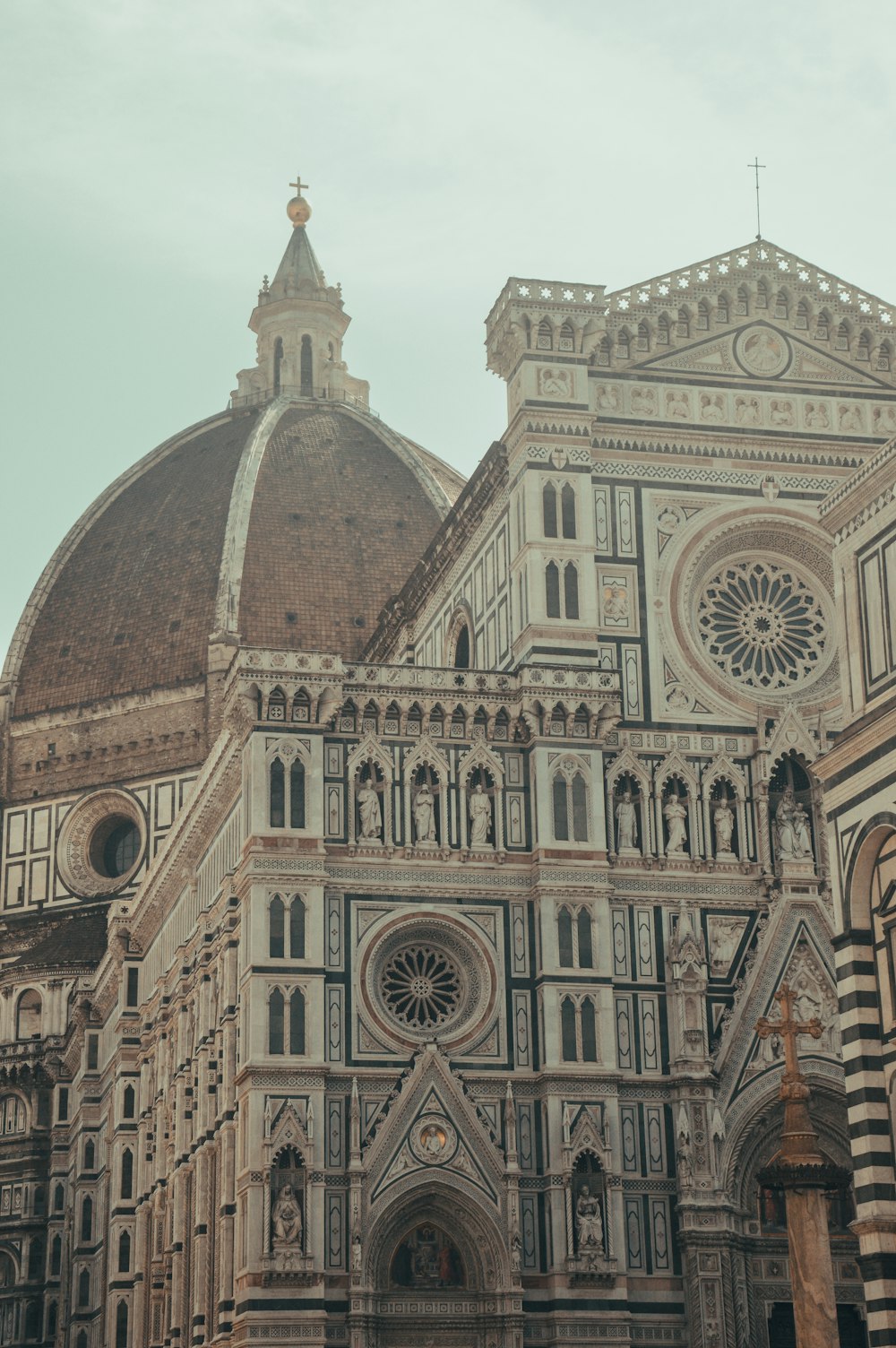 a large cathedral with a clock on it's side