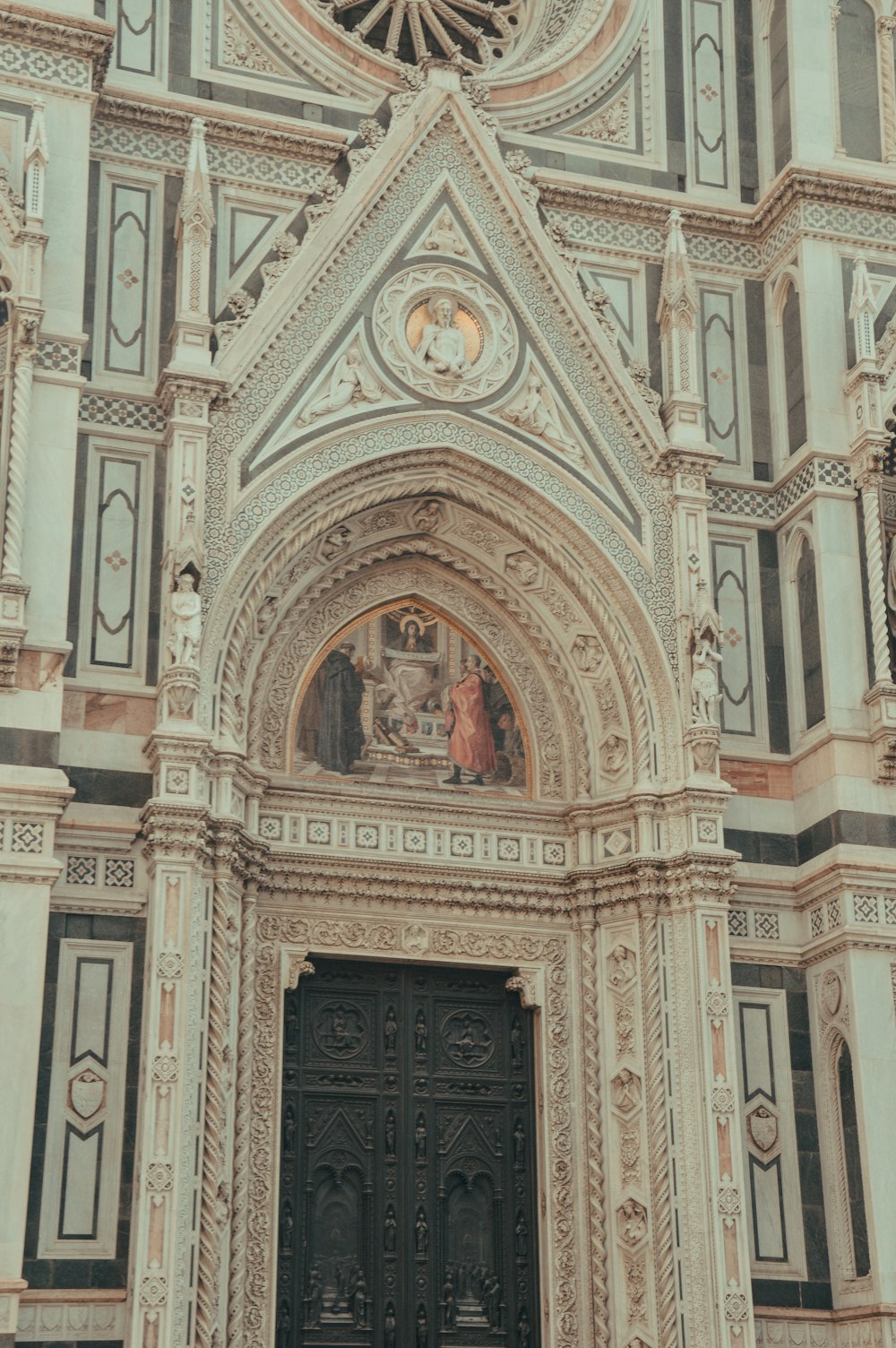 a large ornate building with a clock on it's side