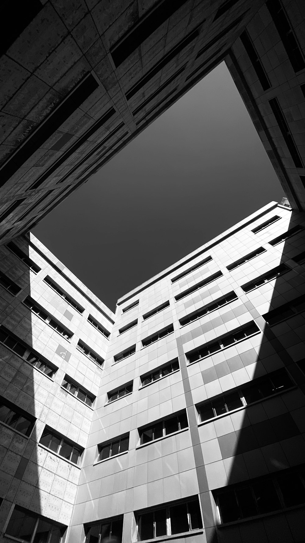 a black and white photo of a tall building