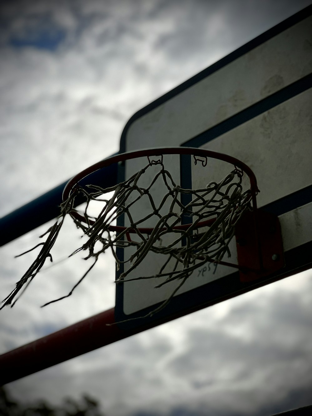 a basketball going through the rim of a basketball hoop
