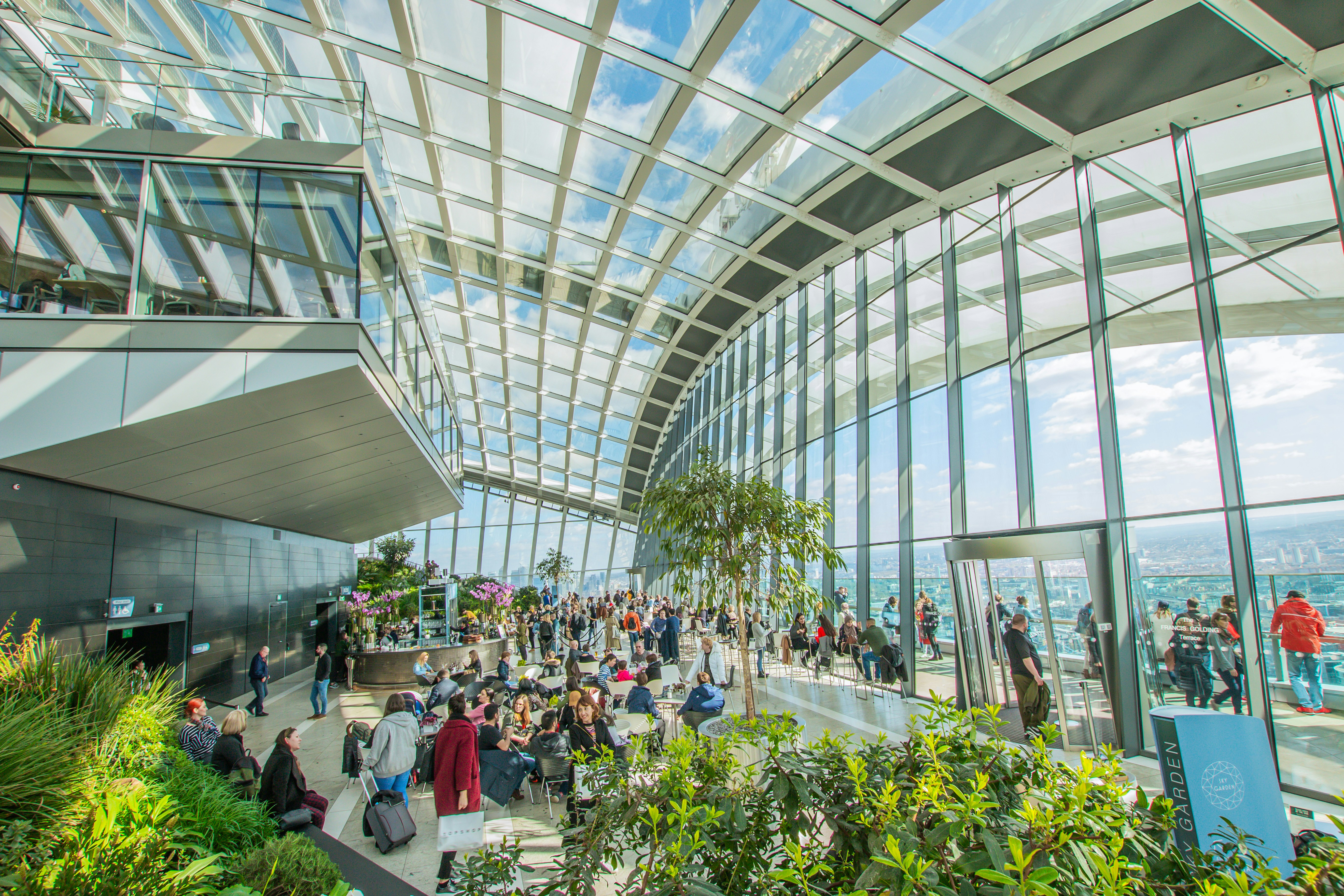 a group of people standing inside of a building