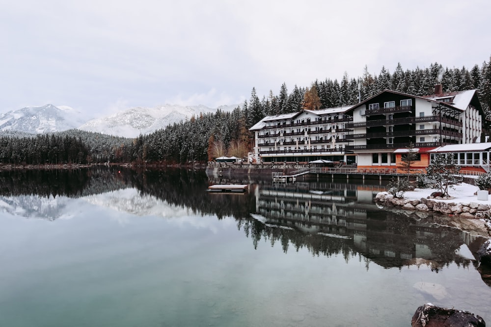 a lake with a hotel in the background