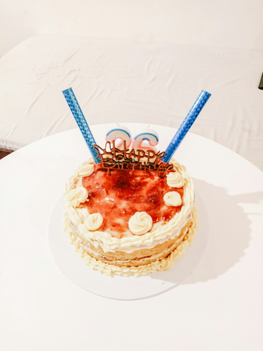 a white table with a cake on top of it