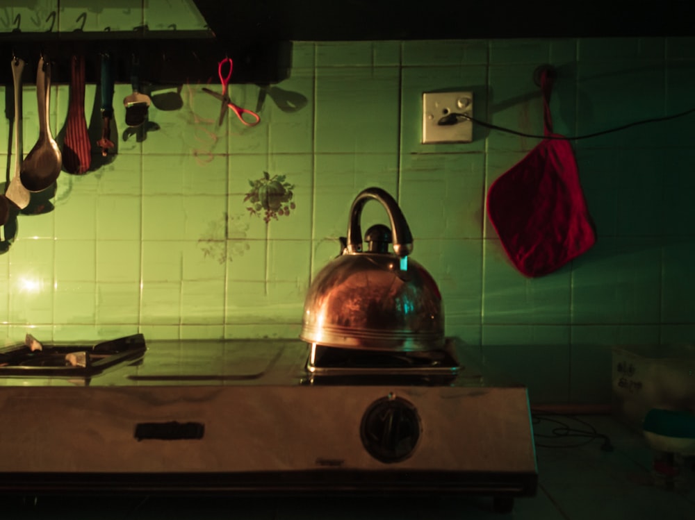 a tea kettle sitting on top of a stove