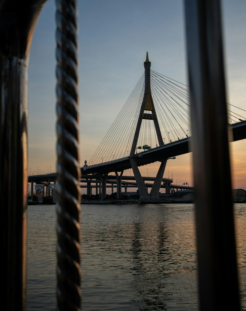 a view of a bridge from across the water