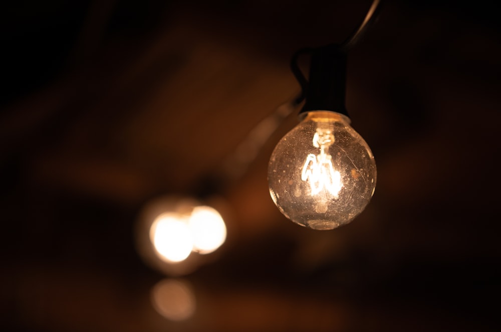 a close up of a light bulb on a dark background