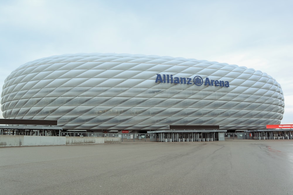 a large soccer stadium with a large white building