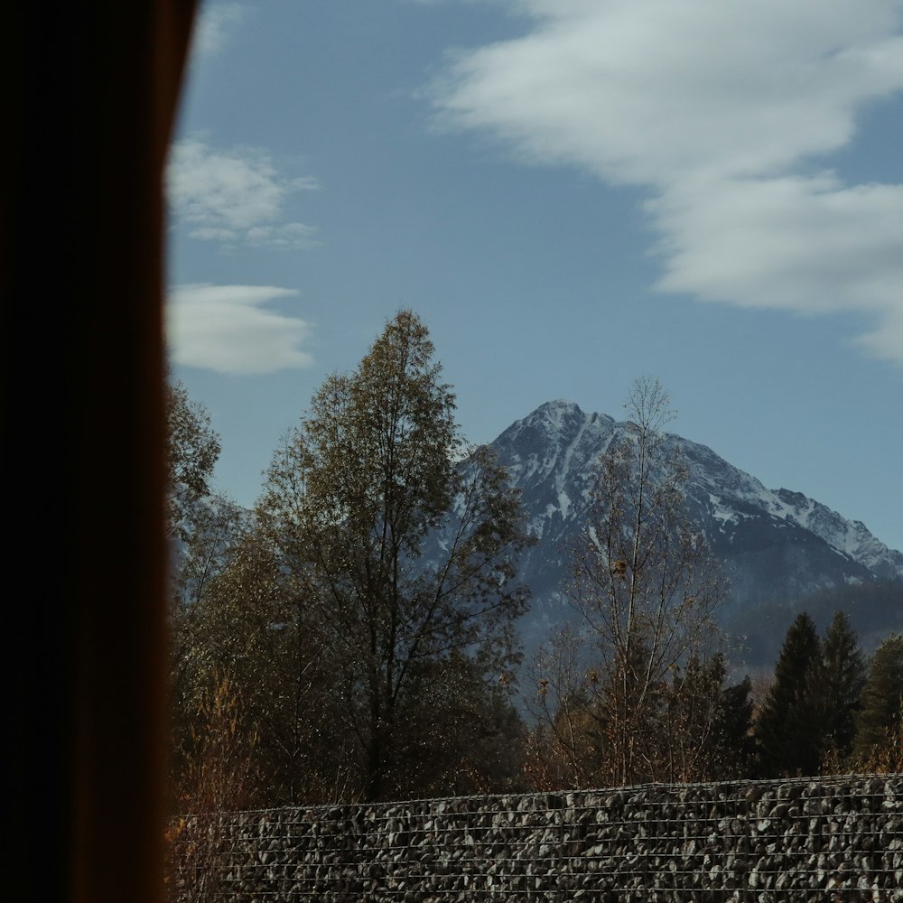 a view of a snowy mountain from a window