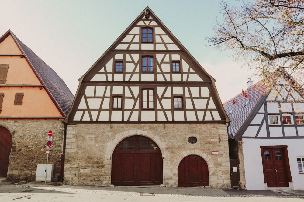 a row of buildings with red doors and windows