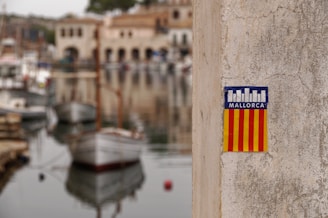 a sticker on the side of a wall near a harbor