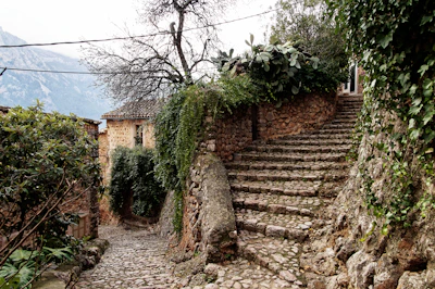 Historic stone pathways winding through quaint villages near Reschen Pass.