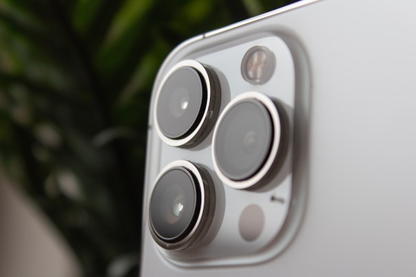 Close-up of a smartphone camera module highlighting its multiple lenses.