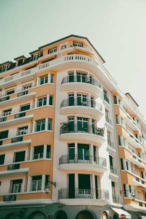 a tall building with balconies and balconies on the top of it