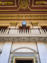 Architectural detail of villa facade highlighting black and gold luxury finishes.