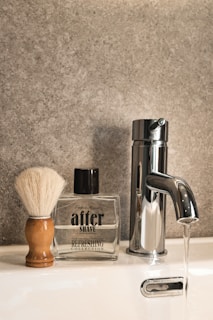 a shaving brush, soap dispenser, and soap dispense