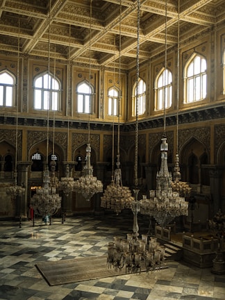 A spacious hall featuring gleaming marble surfaces and natural light.